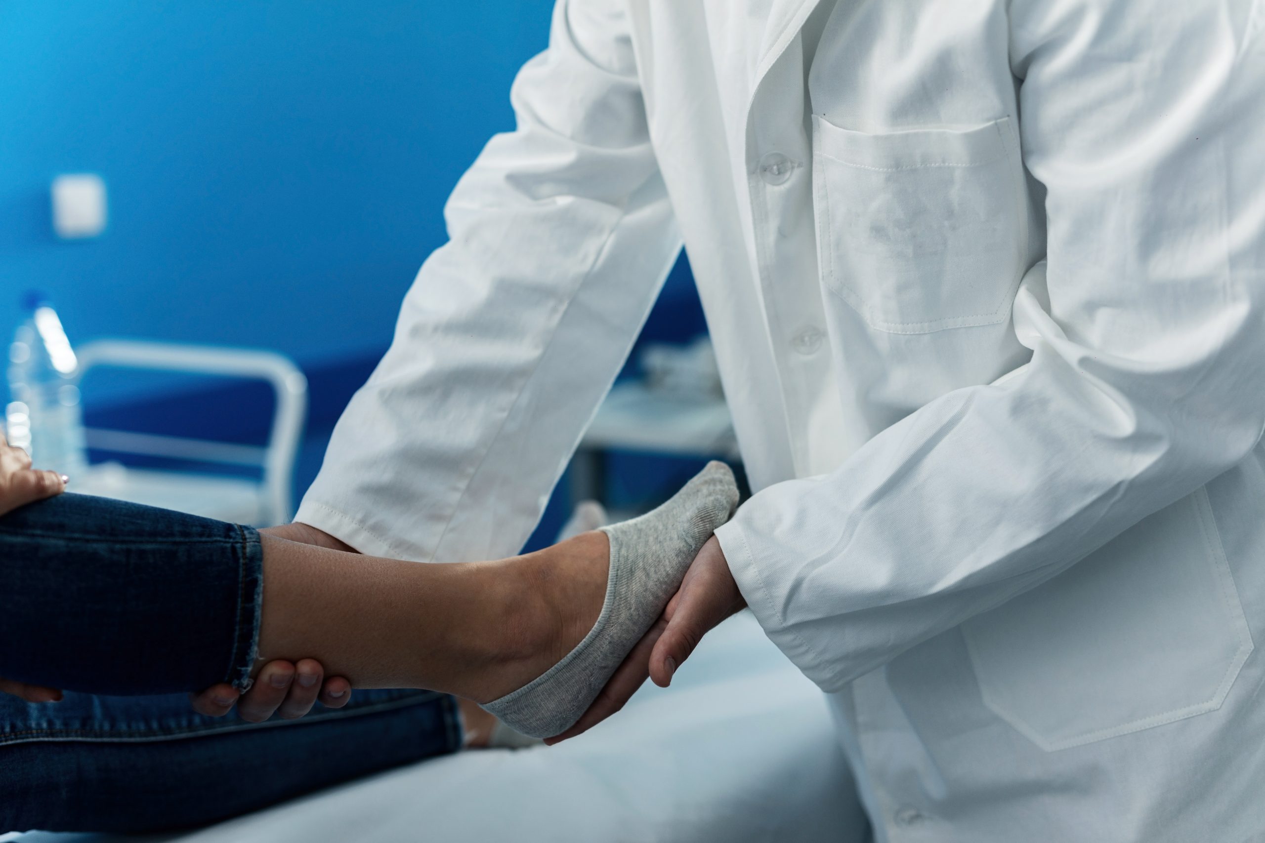 Joyous adult Caucasian lady with a tablet computer in her hands getting an intravenous treatment